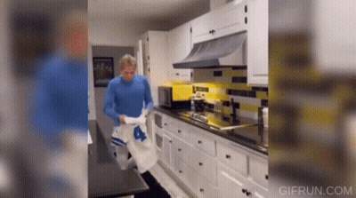 Man In Blue Shirt Standing In Kitchen GIF
