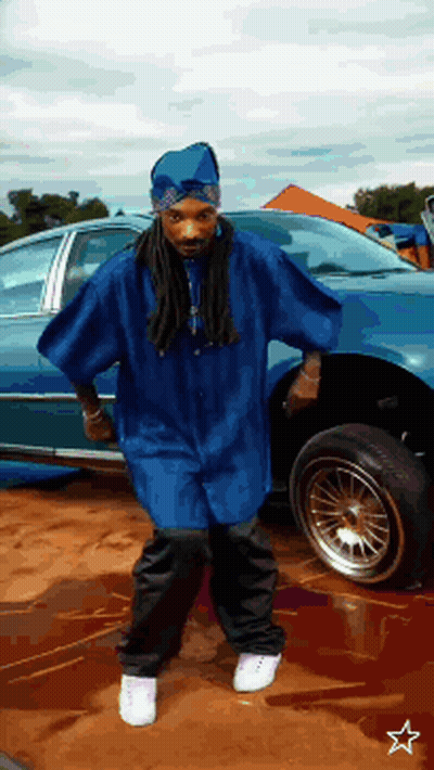 Man In Blue Shirt Standing Next To Car GIF