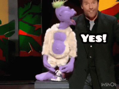 Man In Blue Shirt Standing Next To Puppet GIF