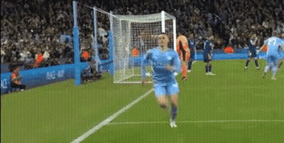Man In Blue Shirt Standing On Soccer Field Eyes Closed GIF