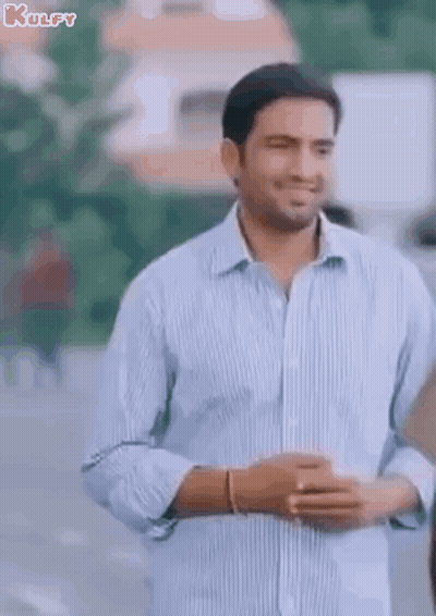 Man In Blue Shirt Standing With Arms Crossed GIF