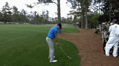 Man In Blue Shirt Swinging Golf Club GIF