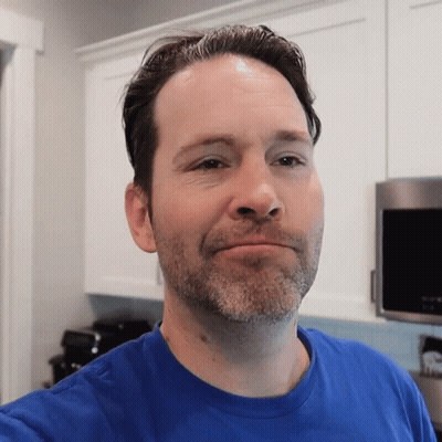 Man In Blue Shirt Taking Selfie GIF