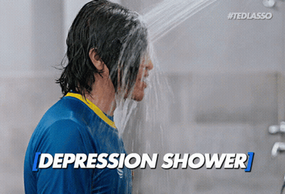 Man In Blue Shirt Taking Shower GIF