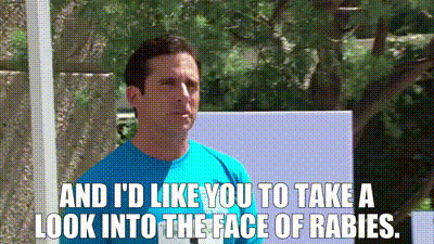 Man In Blue Shirt Talking About Rabies GIF