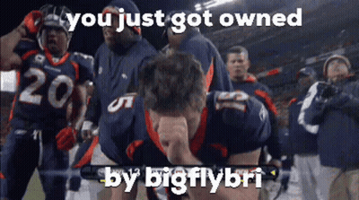 Man In Blue Shirt Talking Into Microphone In Front Of UF Health Sign GIF