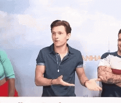 Man In Blue Shirt Talking To Group GIF