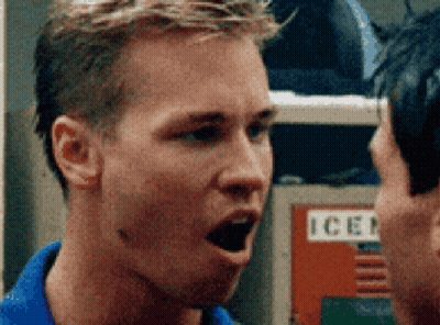 Man In Blue Shirt Talking To Man By Ice Locker GIF