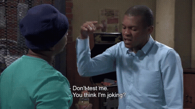 Man In Blue Shirt Talking To Man In Blue Hat GIF