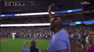 Man In Blue Shirt Throwing Flag At Baseball Game Score 2 To 1 GIF