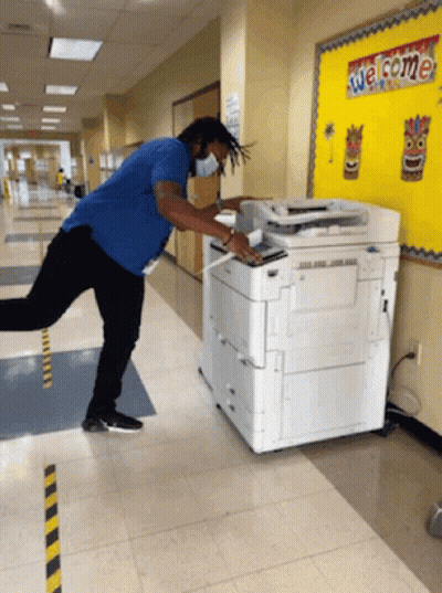 Man In Blue Shirt Using Copier GIF