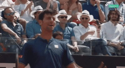 Man In Blue Shirt Watching Tennis Match GIF