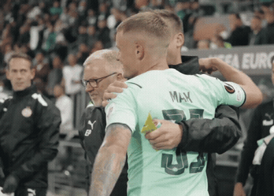 Man In Blue Shirt Waving Hand Vai Perisic GIF
