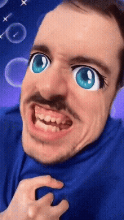 Man In Blue Shirt With Cartoon Face And Big Blue Eyes GIF