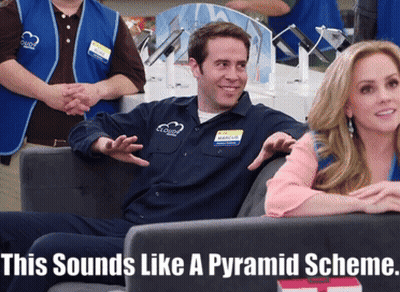 Man In Blue Shirt With Clouds Sits Next To Woman GIF