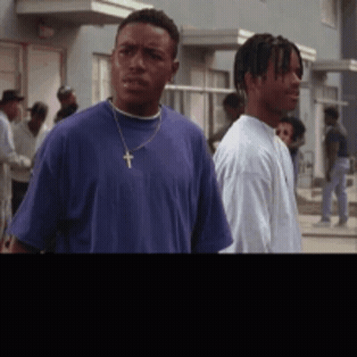 Man In Blue Shirt With Cross GIF