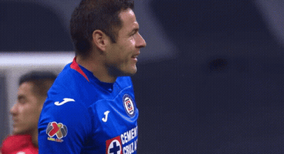 Man In Blue Shirt With Cross GIF