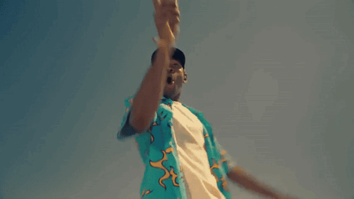 Man In Blue Shirt With Flamingos Dancing In Desert GIF