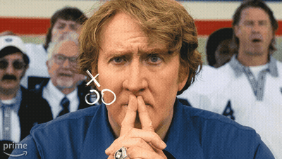 Man In Blue Shirt With Football Players In C Jerseys GIF