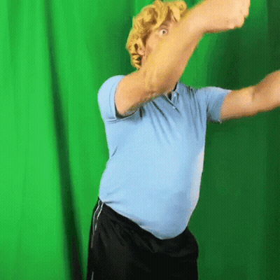 Man In Blue Shirt With Green Background GIF