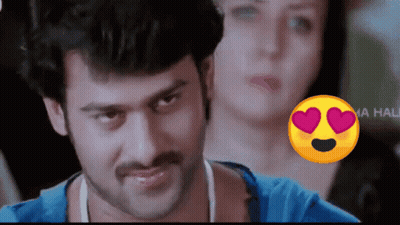 Man In Blue Shirt With Heart Smiley Face GIF