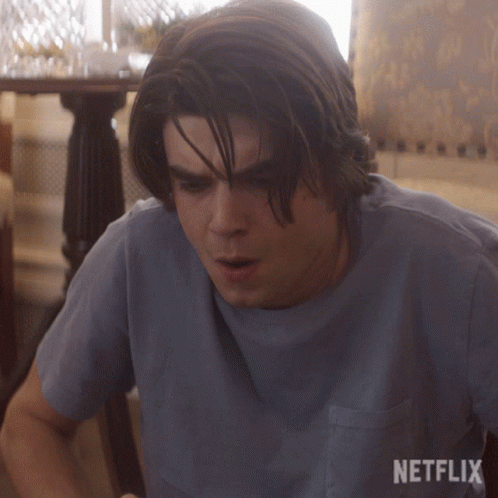 Man In Blue Shirt With Netflix Logo GIF