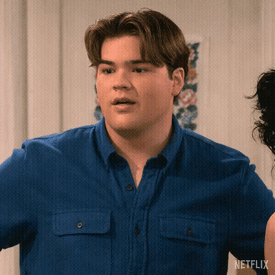 Man In Blue Shirt With Netflix Logo GIF