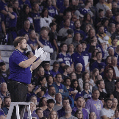 Man In Blue Shirt With Number 9 In Front Of Crowd GIF