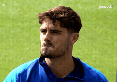 Man In Blue Shirt With Peacock GIF