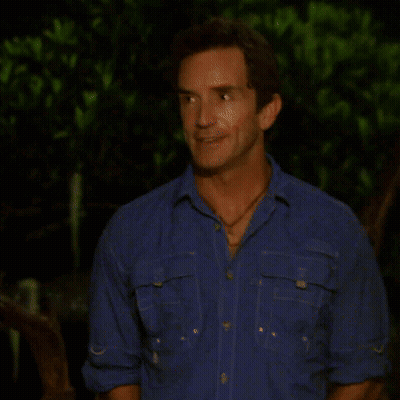 Man In Blue Shirt With Red Spot On Cheek GIF