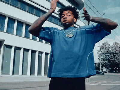 Man In Blue Shirt With Reebok Necklace GIF