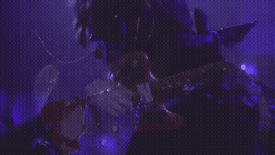 Man In Blue Shirt With Reebok Necklace GIF