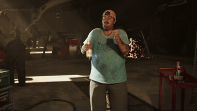 Man In Blue Shirt With RPM In Garage GIF
