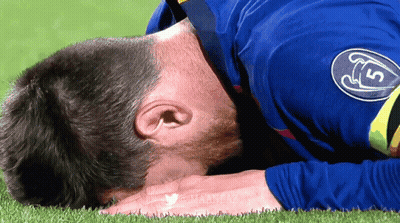 Man In Blue Shirt With S Lying On Grass GIF