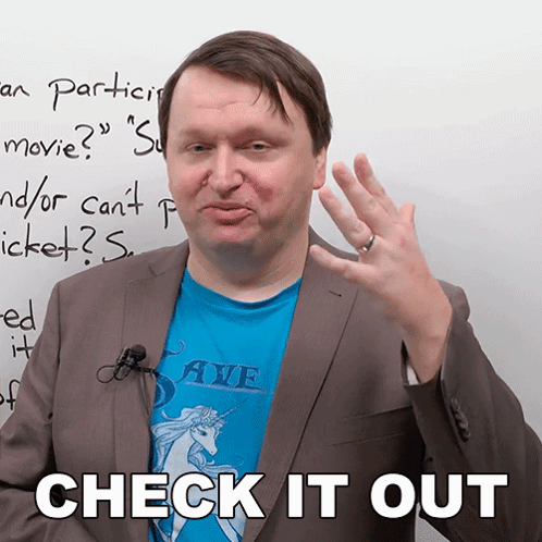 Man In Blue Shirt With Unicorn And Words Check It Out Behind Him GIF