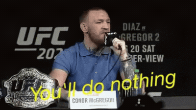 Man In Blue Shirt You'll Do Nothing Sign GIF
