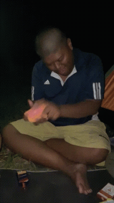 Man In Blue Striped Shirt Eating Food GIF