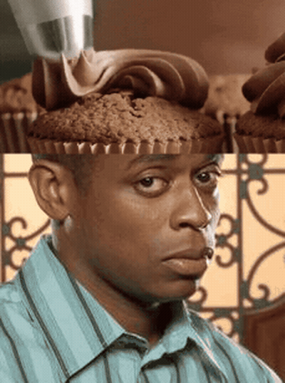Man In Blue Striped Shirt Looking At Cupcake On Head GIF