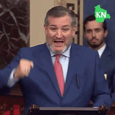 Man In Blue Suit And Red Tie With Green Kn Sticker On Head GIF