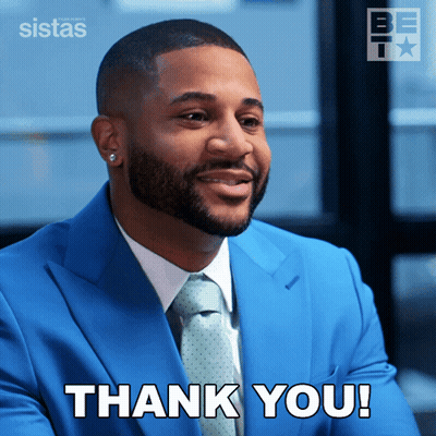 Man In Blue Suit And Tie Says Thank You GIF