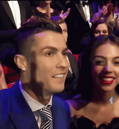 Man In Blue Suit And Tie Smiling Next To Woman GIF