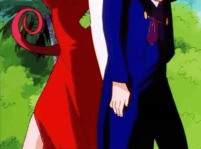 Man In Blue Suit And Woman In Red Dress GIF