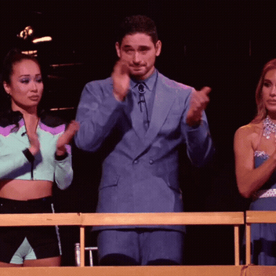 Man In Blue Suit Applauding With Two Women GIF