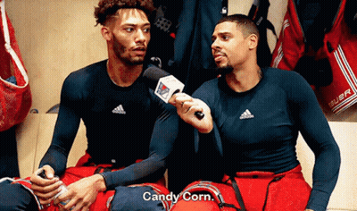 Man In Blue Suit Behind Toronto Maple Leafs Hockey Player GIF