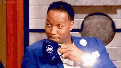 Man In Blue Suit Drinking From Mug With Bird GIF