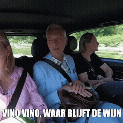 Man In Blue Suit In Car With Two Women Saying Vino Vino GIF
