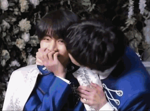 Man In Blue Suit Kissing Man In White Suit GIF