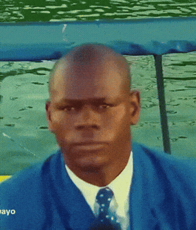 Man In Blue Suit Looking At Camera Saying Ayo GIF