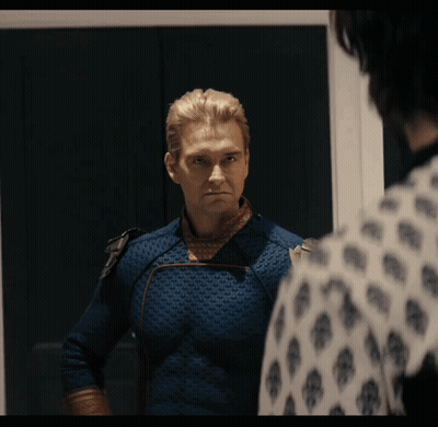 Man In Blue Suit Looking In Mirror GIF