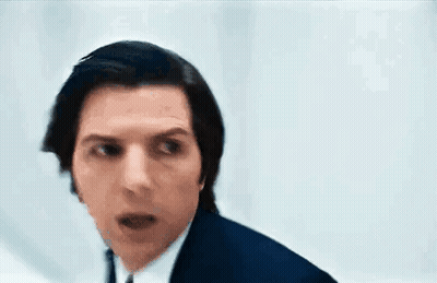 Man In Blue Suit Making Funny Face GIF